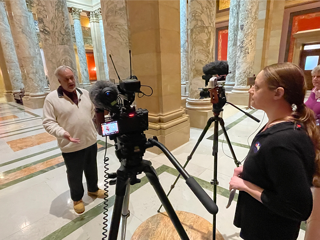 Reporter interviewing a politician in the MN State Capitol