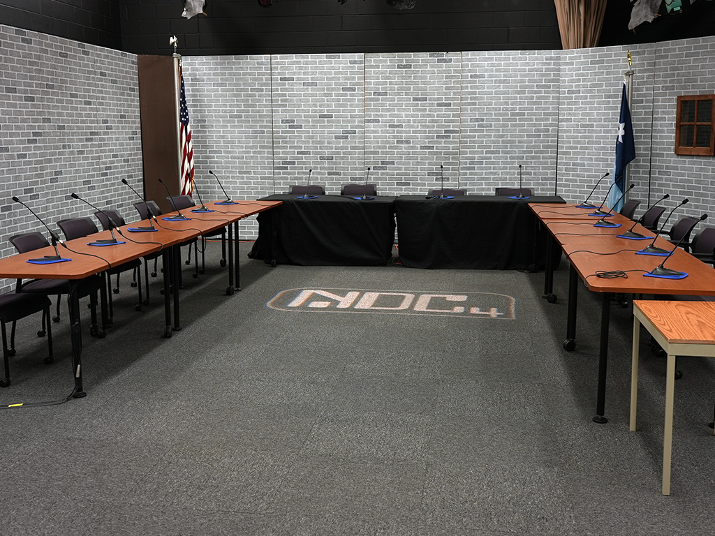 Town Square Television studio set for a meeting